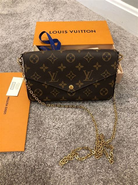 louis vuitton black purse with gold chain|louis vuitton black checkered purse.